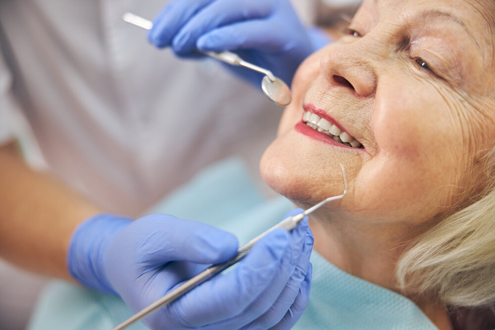 A woman having her teeth checked